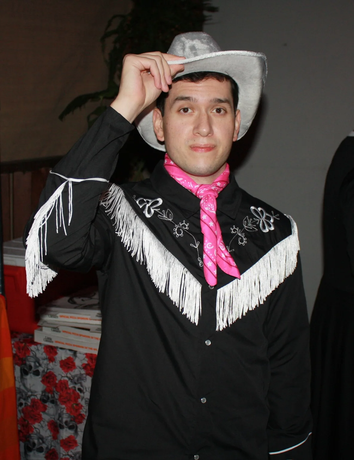 Cameron tipping his cowboy hat at the Halloween party